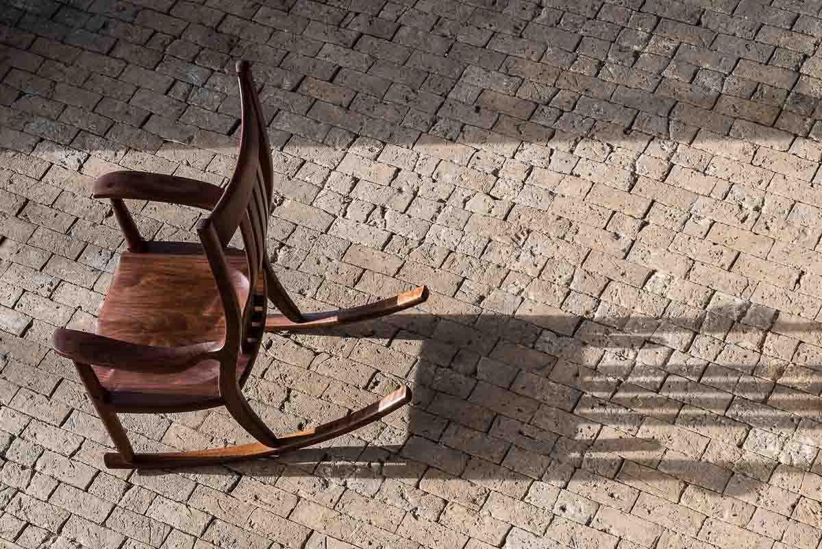walnut rocking chair in the sunshine
