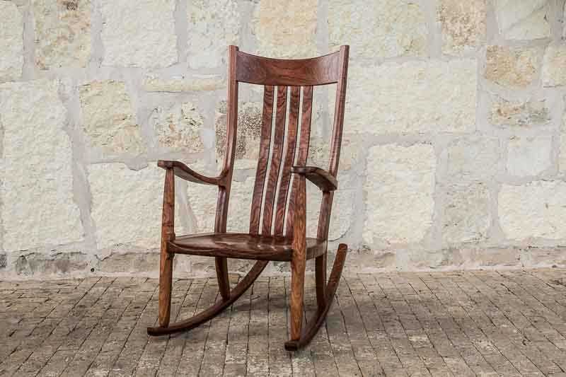 a comfortable rocking chair on bricks