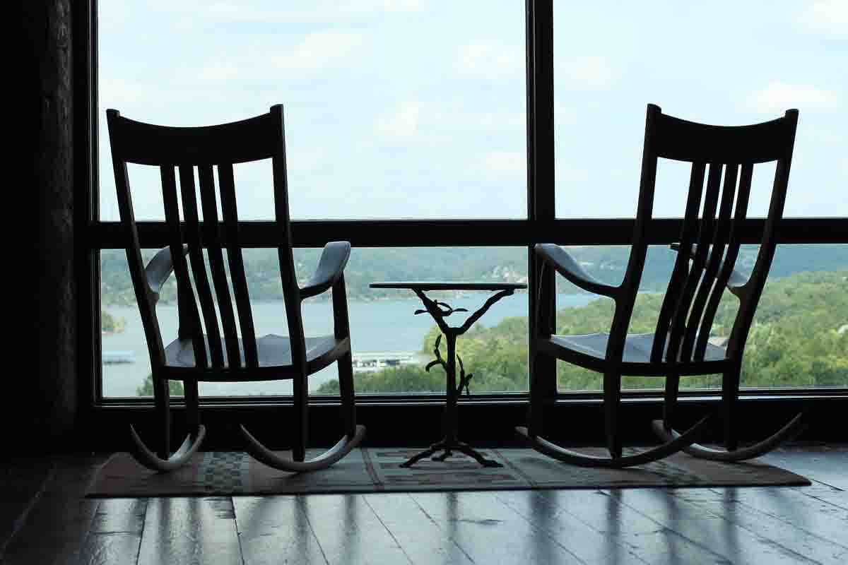 Two rocking chairs and view of a lake